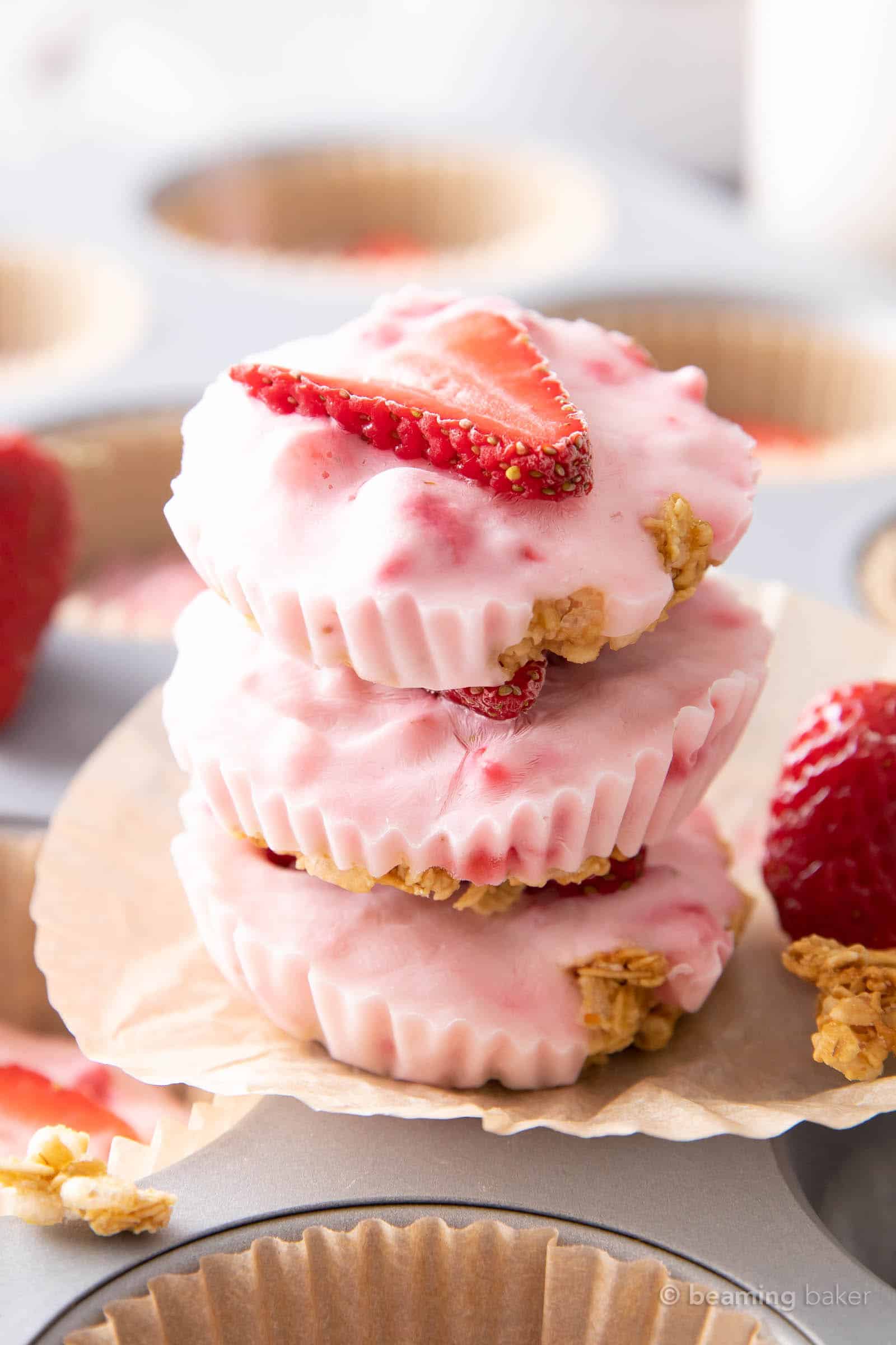 Strawberry frozen yogurt in glass bowl, ice cream balls, container