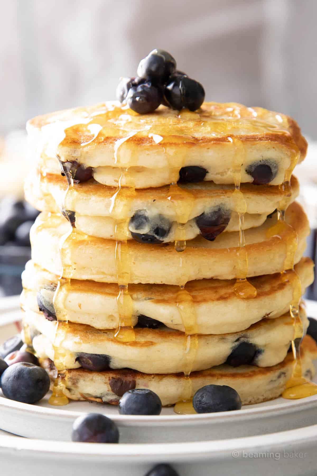 vegan blueberry pancakes in a tall stack on a plate