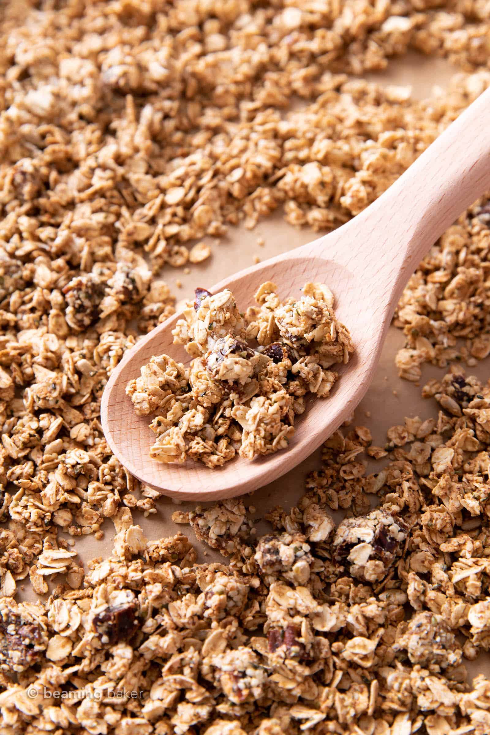 Wooden spoon scooping up hemp granola