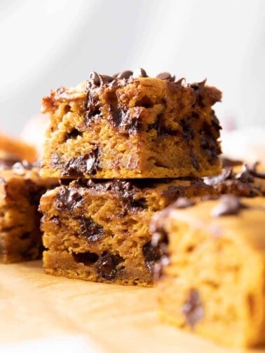 Closeup of two pumpkin chocolate chip bars stacked one on top of another