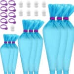 Set of blue reusable piping bags with tip attachments.