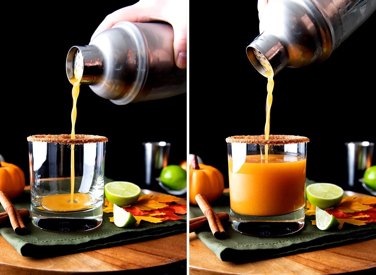Someone pouring this pumpkin spice cocktail from a cocktail shaker into a cocktail glass with a pumpkin spice rim