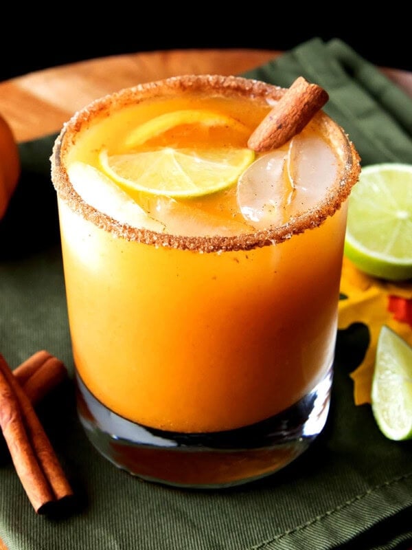 pumpkin cocktail made with tequila, pumpkin puree, and lime juice is served in an old fashioned glass