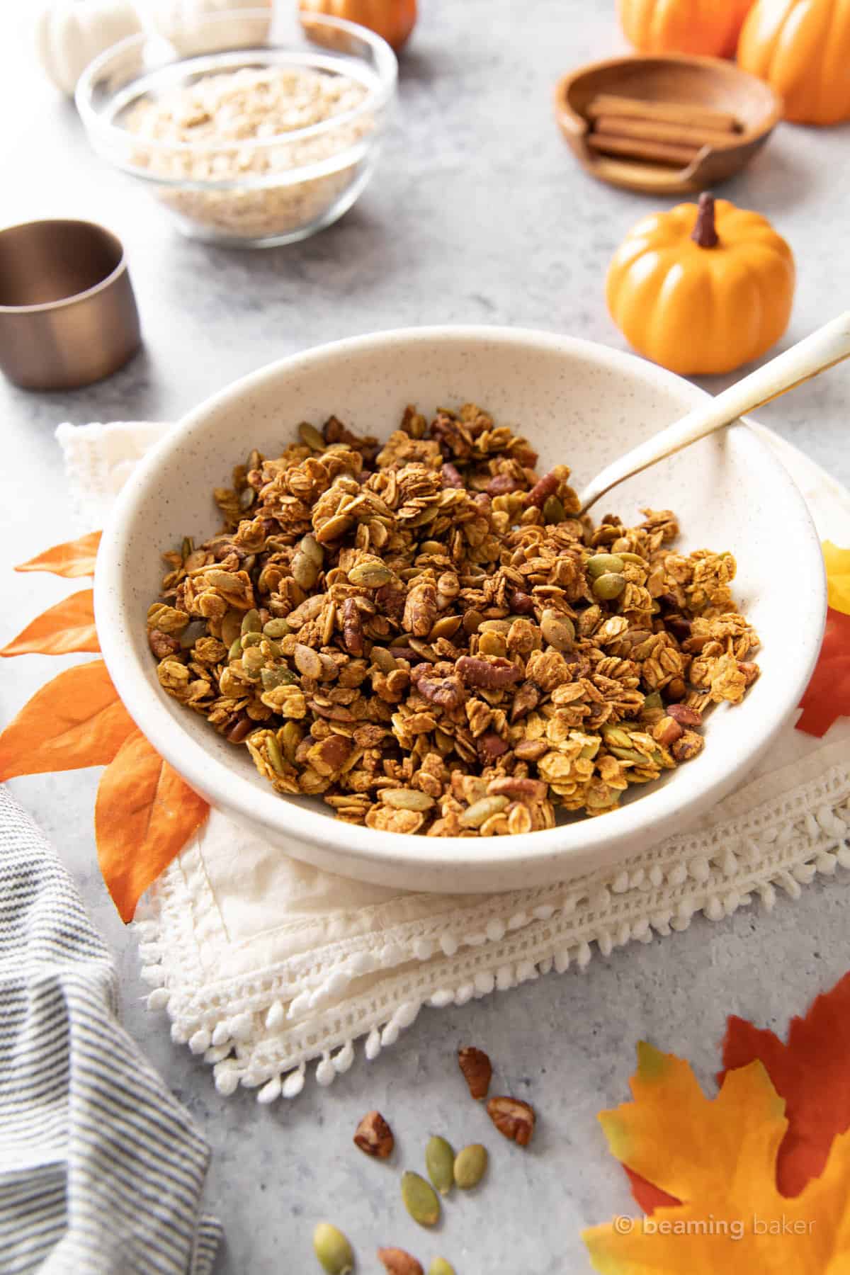 pumpkin granola in a speckled bowl