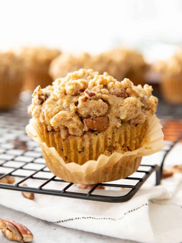 Closeup photo of cinnamon streusel muffin with the muffin liner peeled off