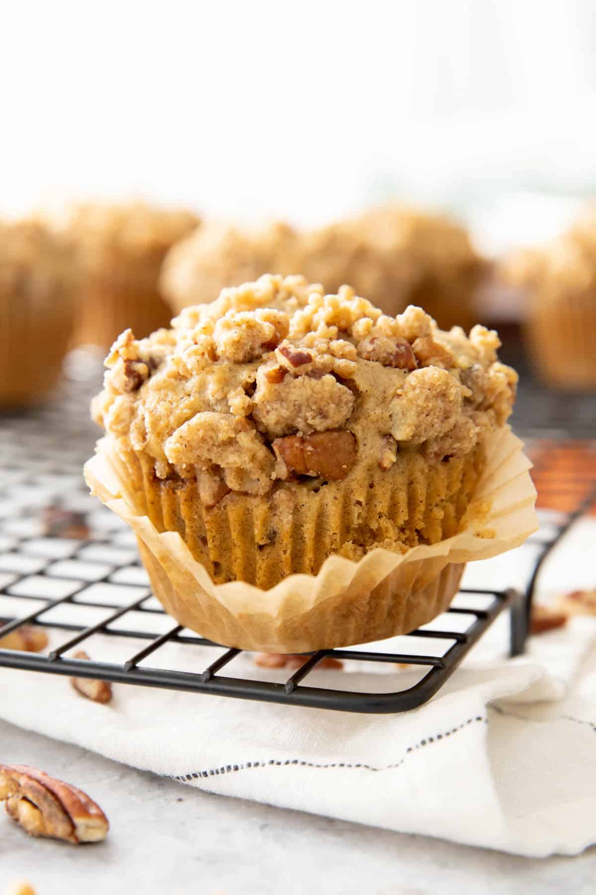 Closeup photo of cinnamon streusel muffin with the muffin liner peeled off