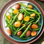 roasted green beans and potatoes on a plate