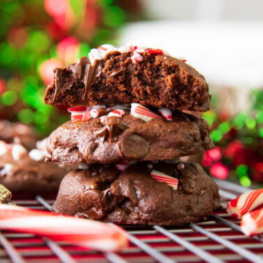 Stack of easy chocolate peppermint cookies showing fudgy centers and peppermint candy