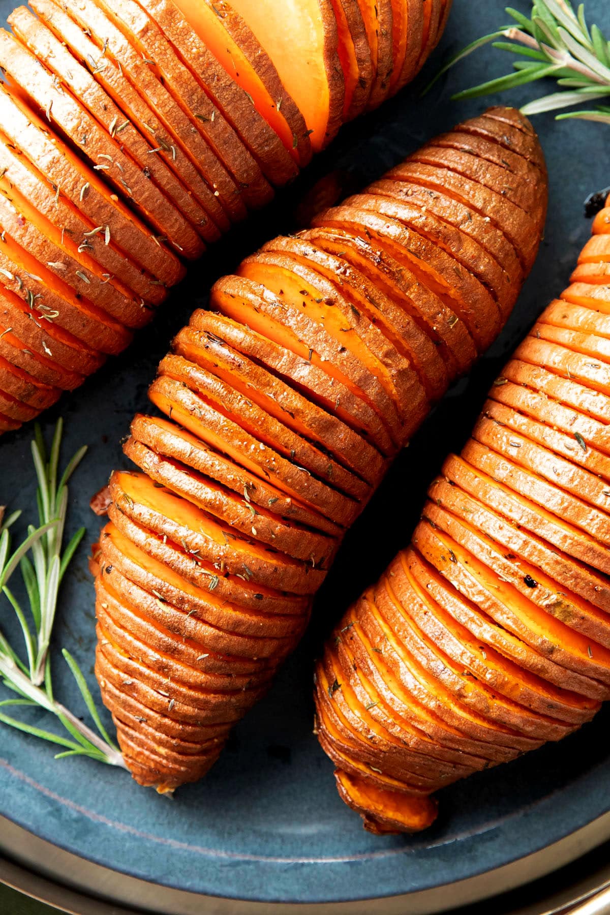 closeup of Hasselback sweet potatoes to show thin slices