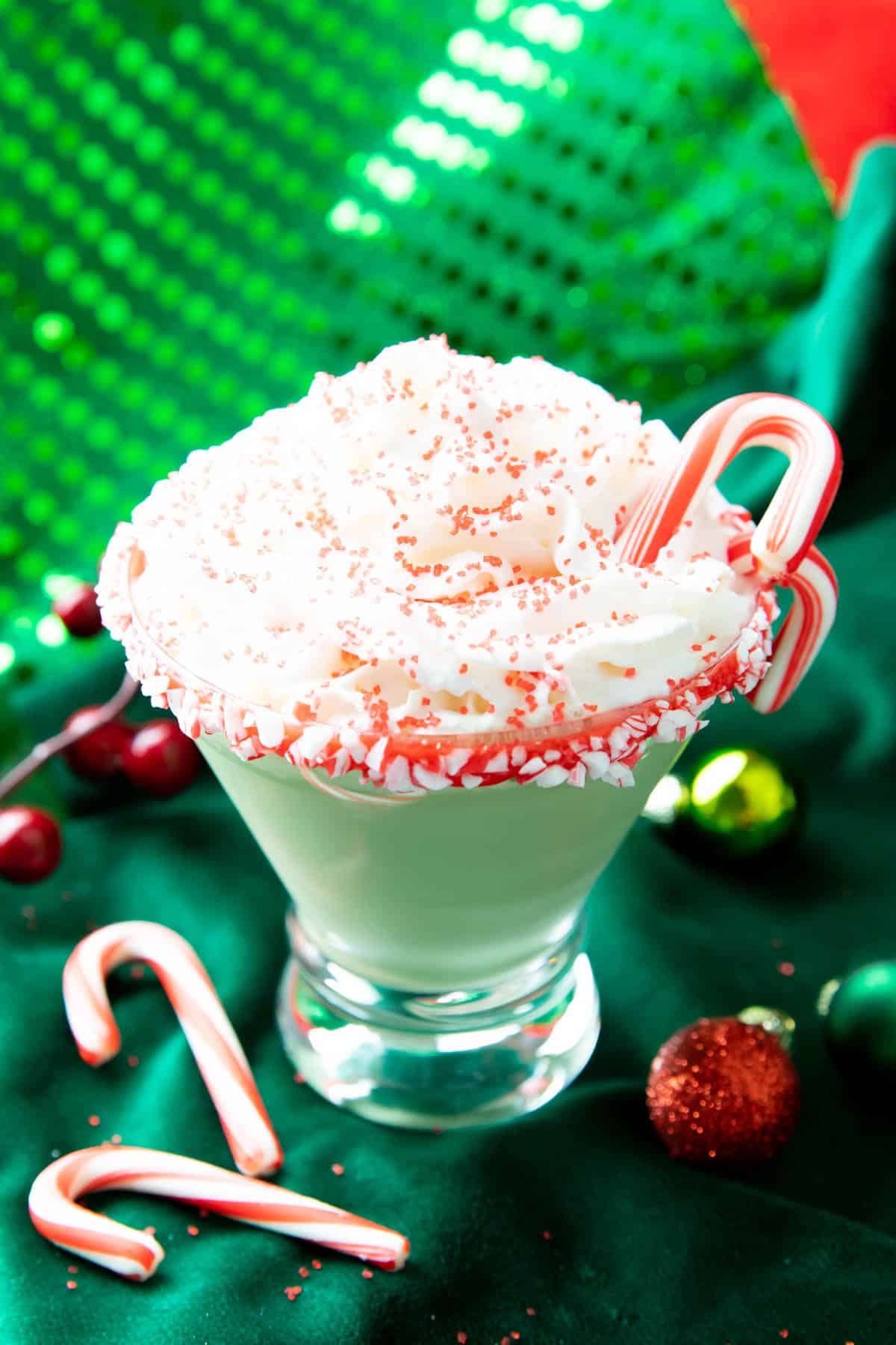 Peppermint Martini topped with whipped cream in a martini glass