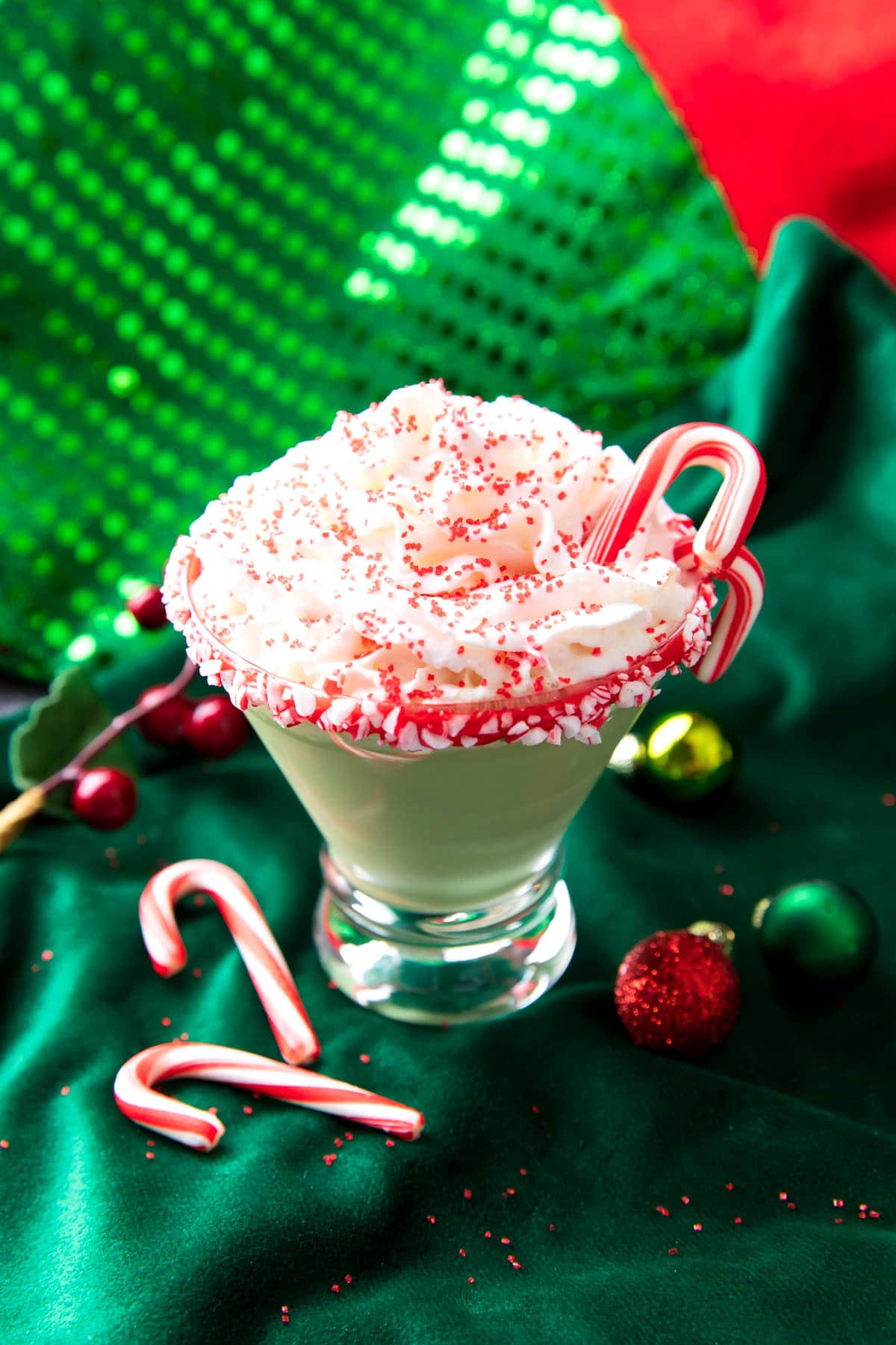 This peppermint martini recipe is creamy and minty served with Christmas sprinkles.