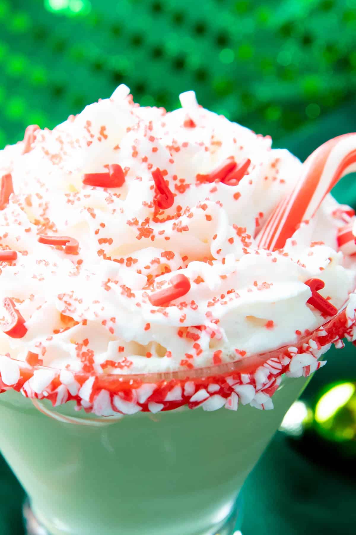 Closeup photo of candy cane sprinkles on cocktail drink