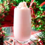 square photo of peppermint milkshake with candy canes