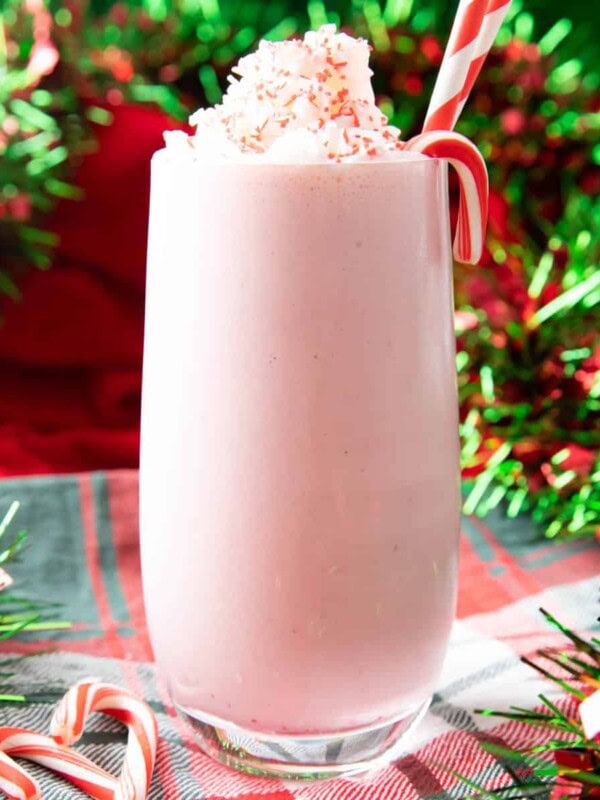 square photo of peppermint milkshake with candy canes