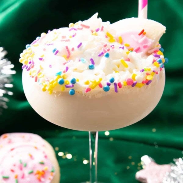 Sugar cookie martini with sprinkles and pink straw