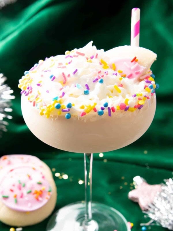 Sugar cookie martini with sprinkles and pink straw