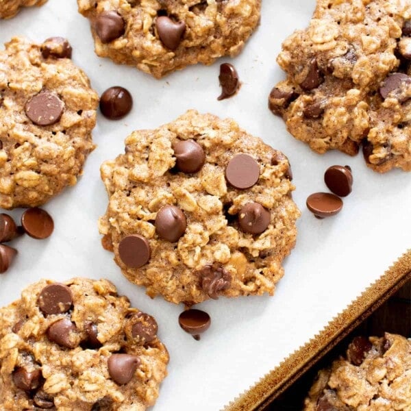 square photo of healthy cookies on a lined baking sheet