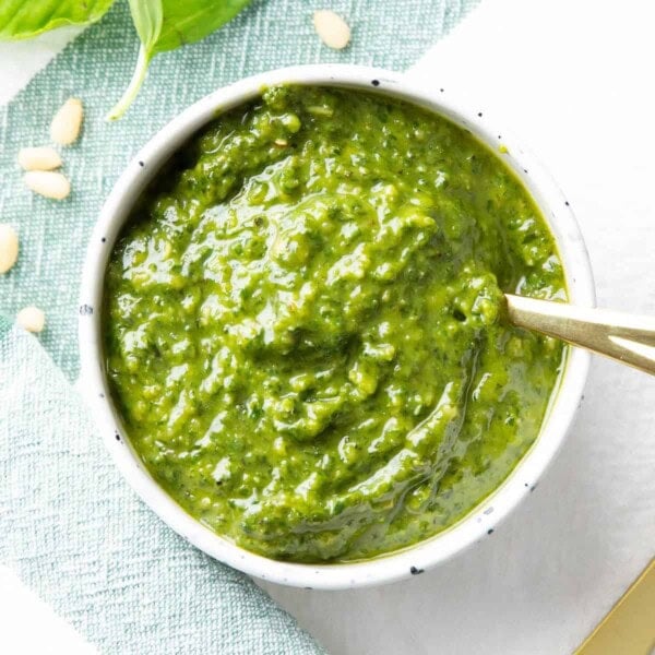 feature photo of vegan pesto in a white ceramic bowl