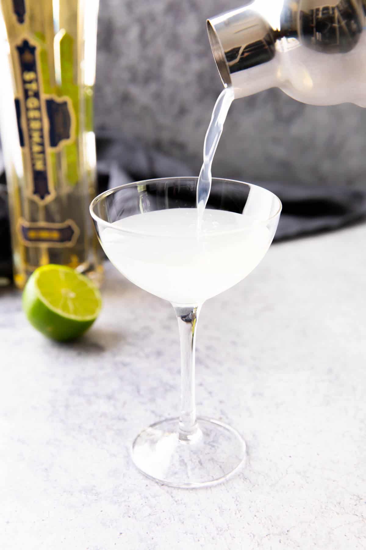 showing how to make a French Gimlet – last pour of the cocktail