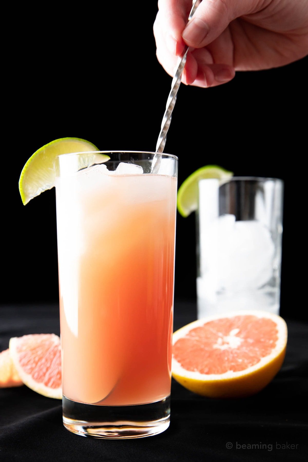 One photo showing How to Make a Greyhound Drink – stirring with a cocktail spoon.