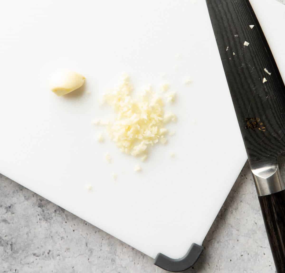 One photo showing How to Make Garlic Toast – mincing garlic