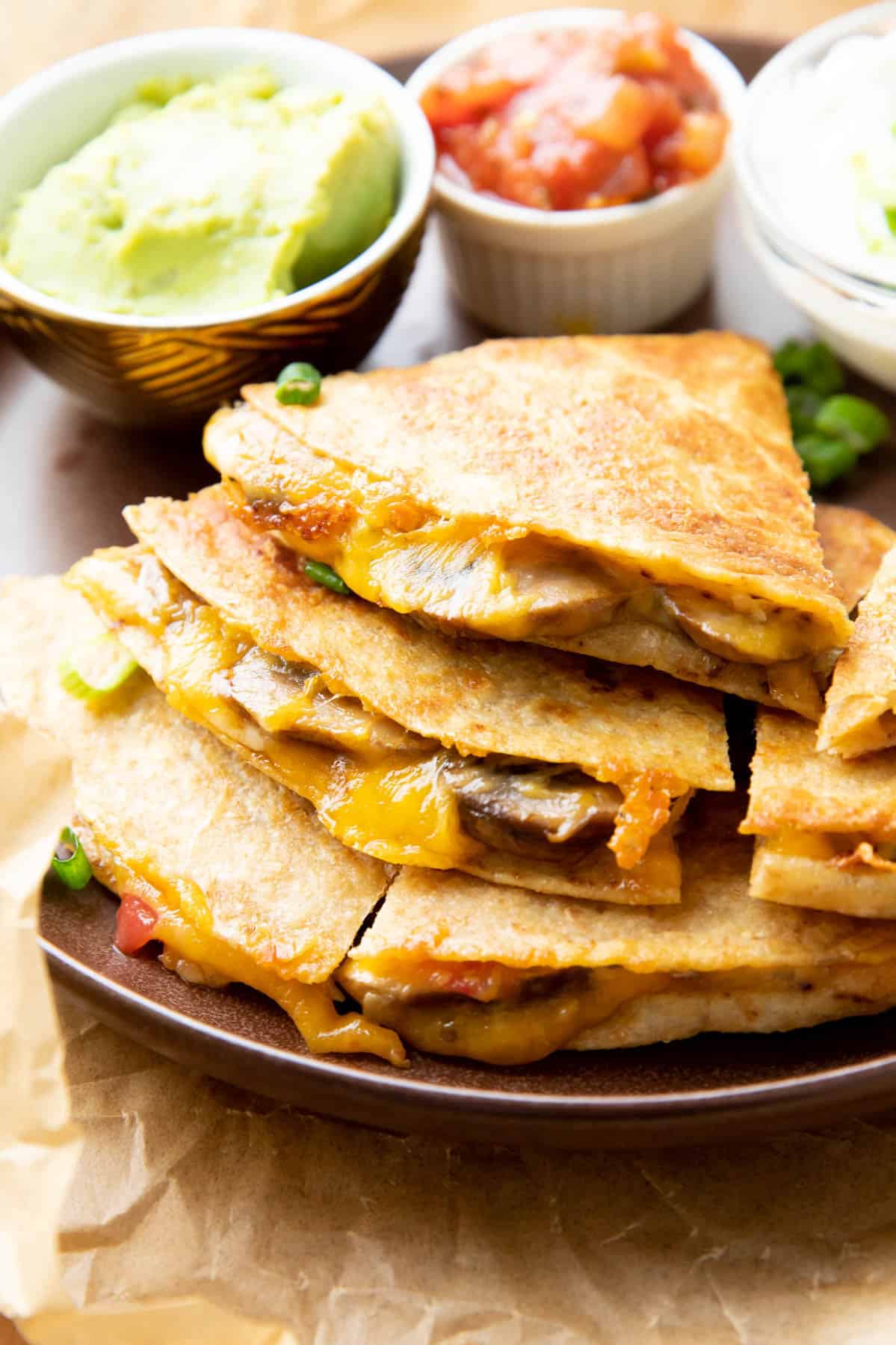 Mushroom Quesadilla sliced and stacked on a plate