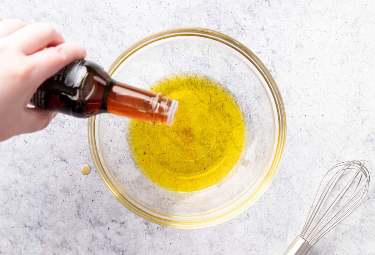 Photo showing How to Make Asian Salad Dressing – adding sesame oil