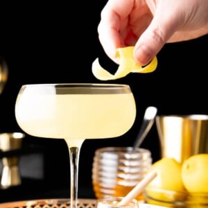 Adding lemon garnish onto the rim of this drink recipe