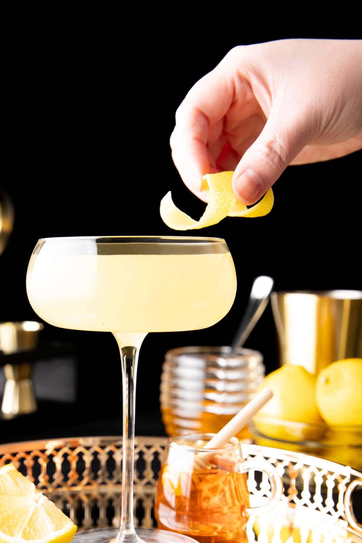 Adding lemon garnish onto the rim of this drink recipe
