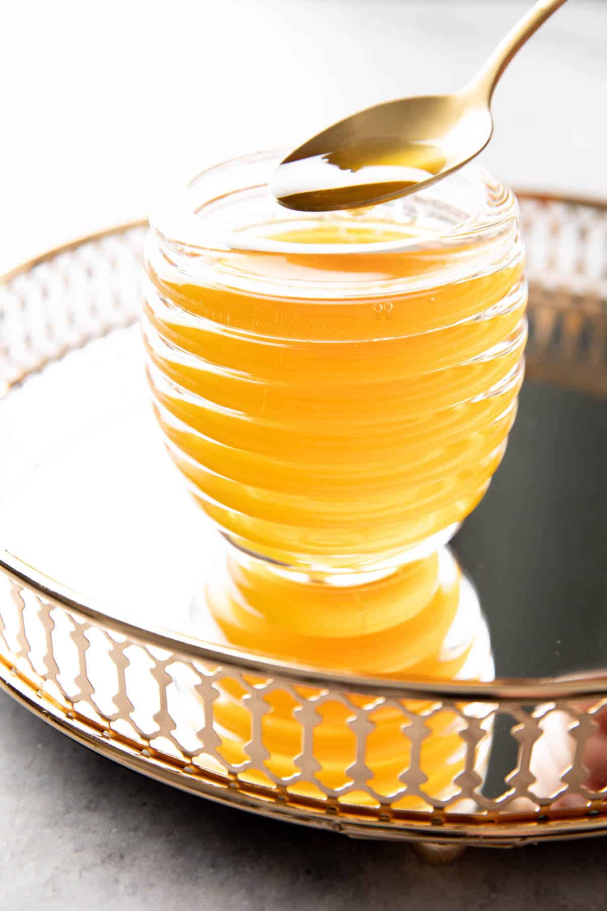 this honey simple syrup recipe in a beehive-shaped jar