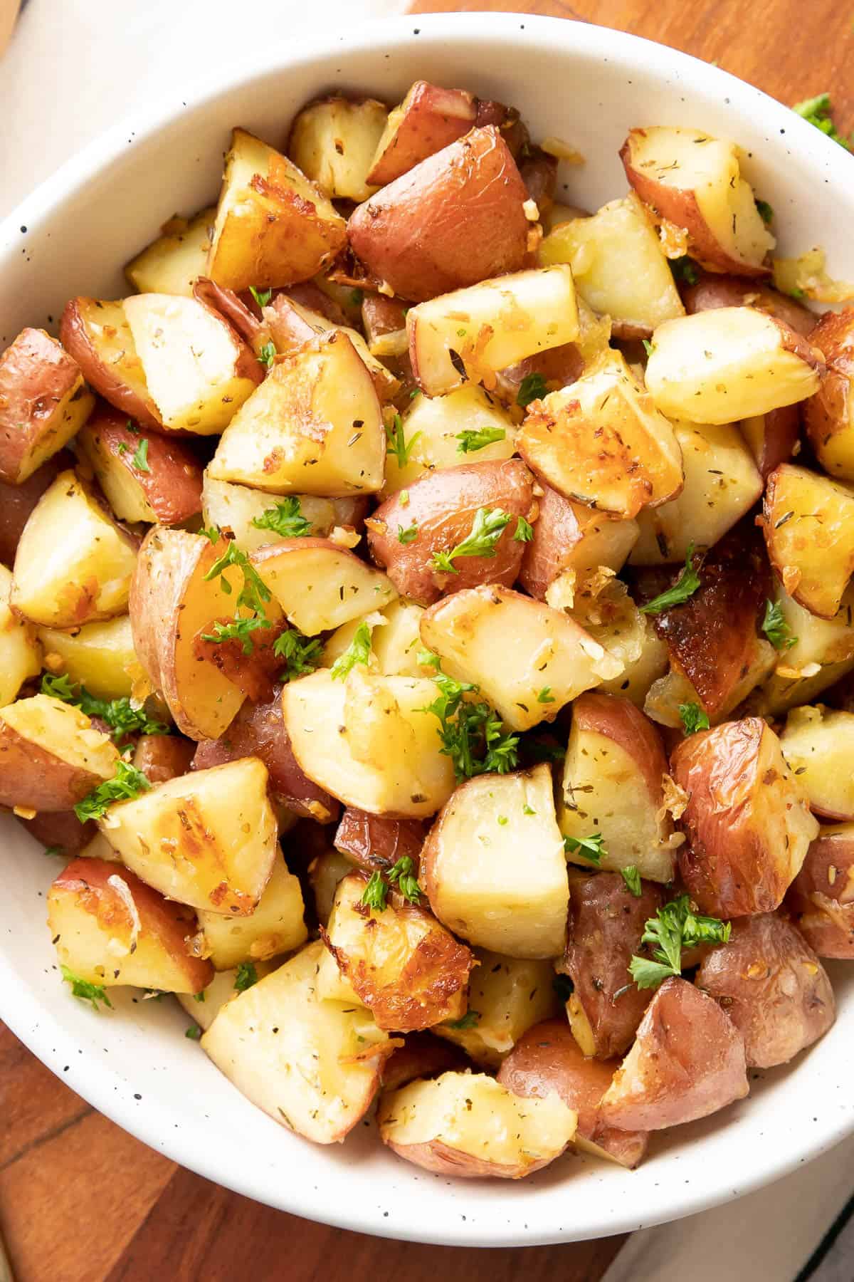 Close up of Garlic Roasted Potatoes topped with parsley