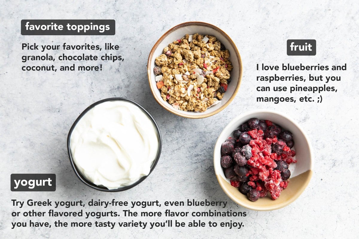 3 ingredients for yogurt bars laid out on a table in bowls