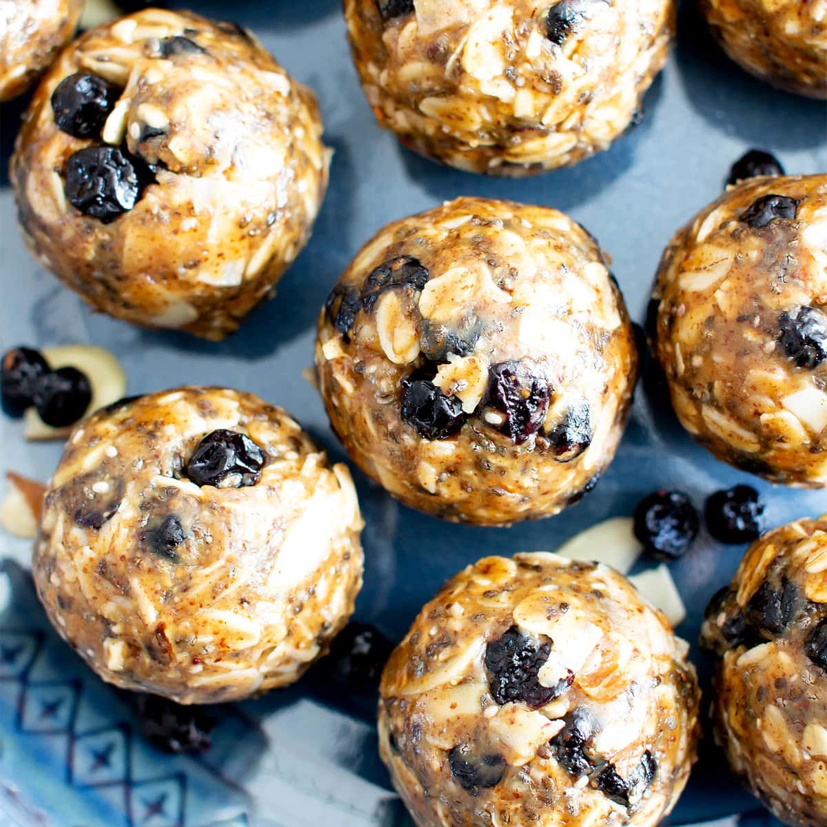Blueberry almond chia energy balls on a blue plate