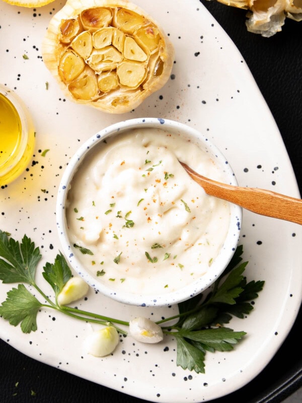 Close up of Roasted Garlic Aioli served in a ceramic bowl.