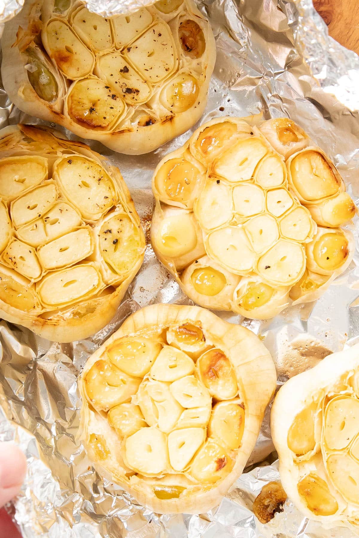 Two photos showing How to Make Roasted Garlic Bread – roast the garlic