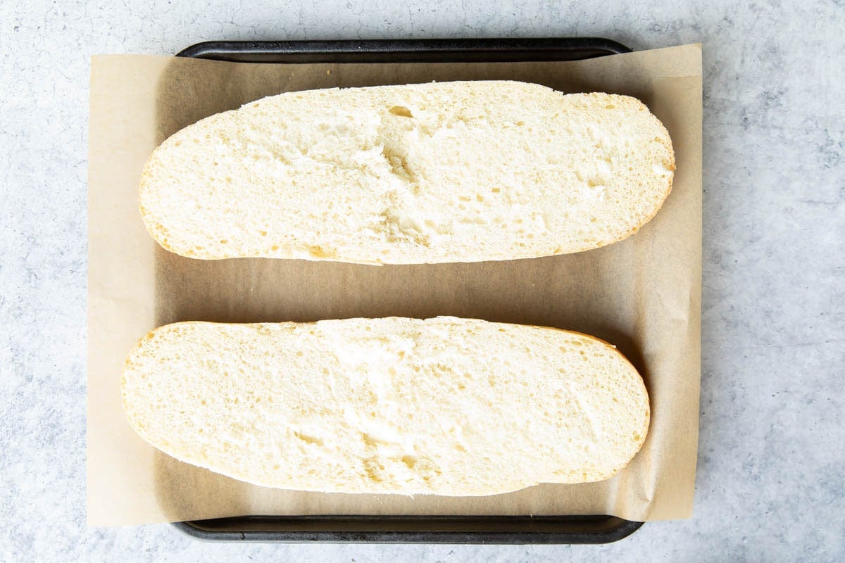 Two photos showing How to Make Garlic Bread – slice the loaf of bread in half