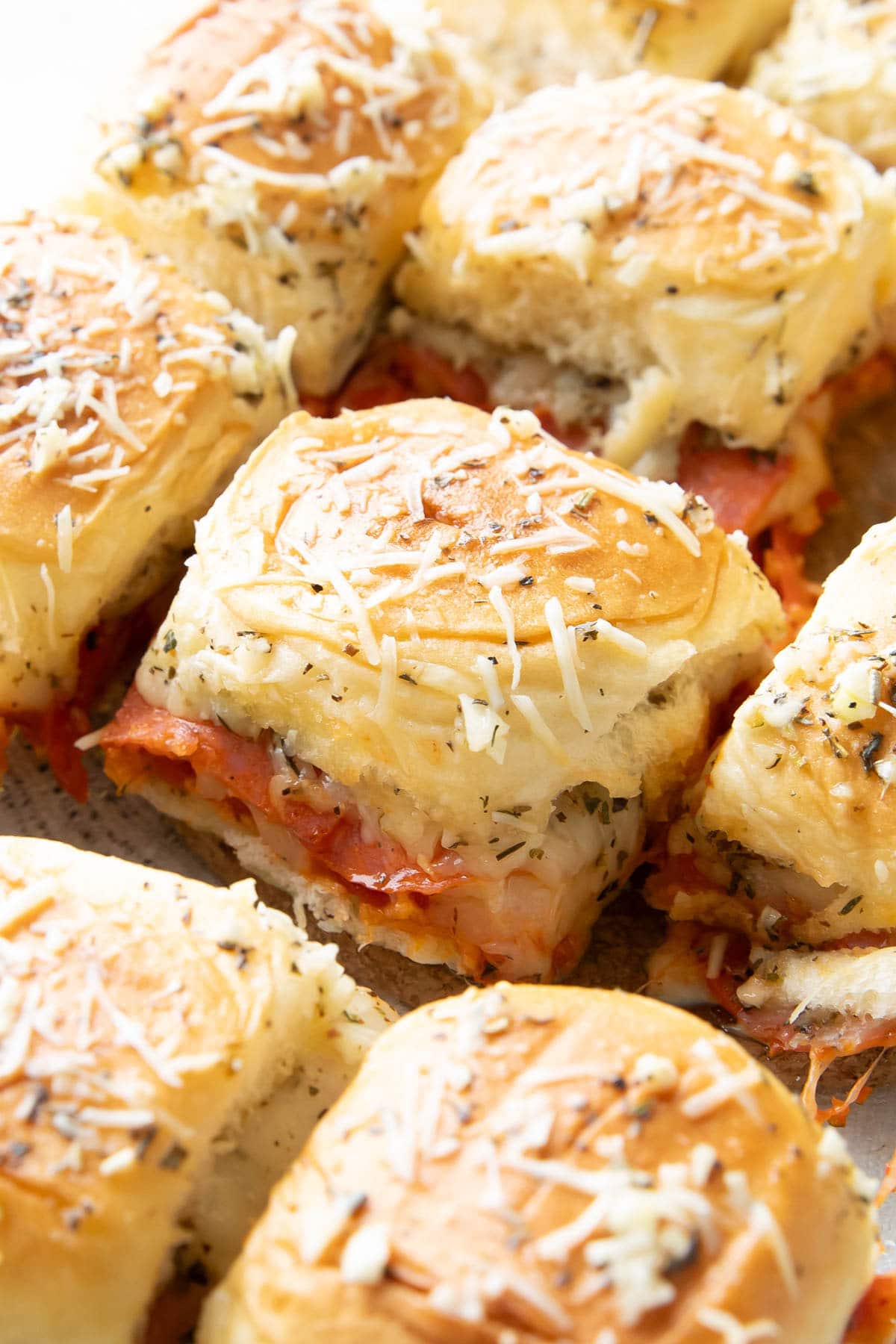 Pizza Sliders freshly baked and sliced with parmesan topping