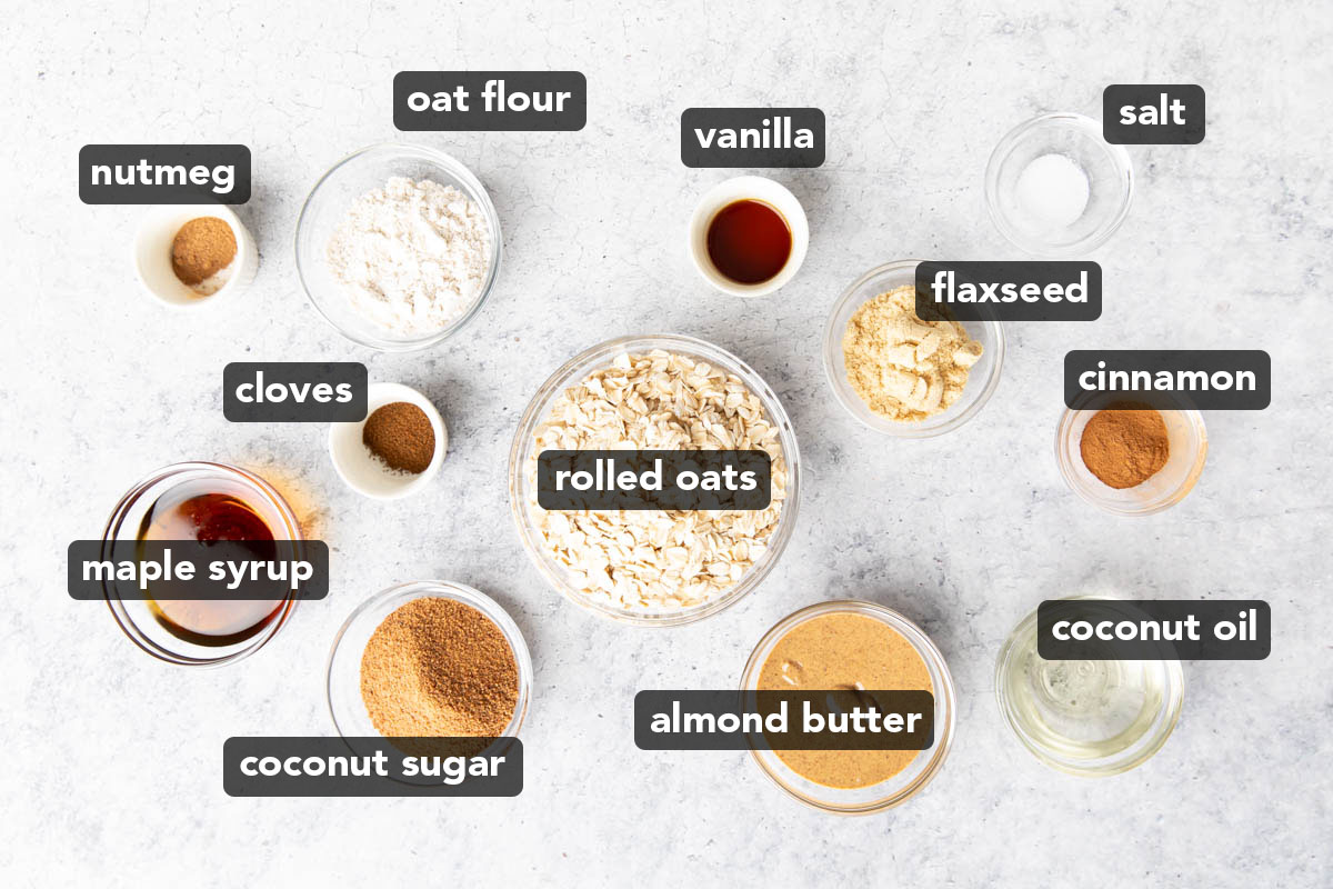 Vegan Oatmeal Cookies Ingredients measured into bowls with ingredients like oats, oat flour, coconut sugar, and more