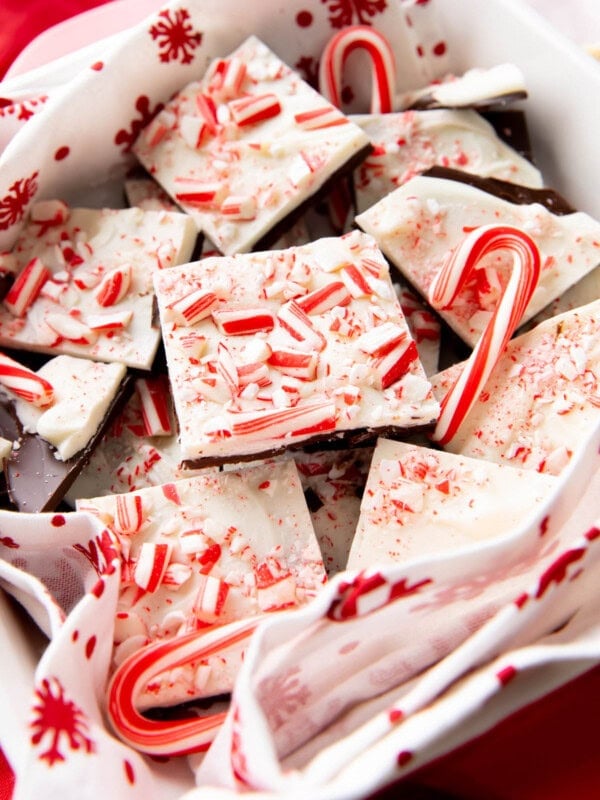 Close up of this peppermint bark recipe to show layers of white and semi-sweet chocolate and crushed candy cane pieces