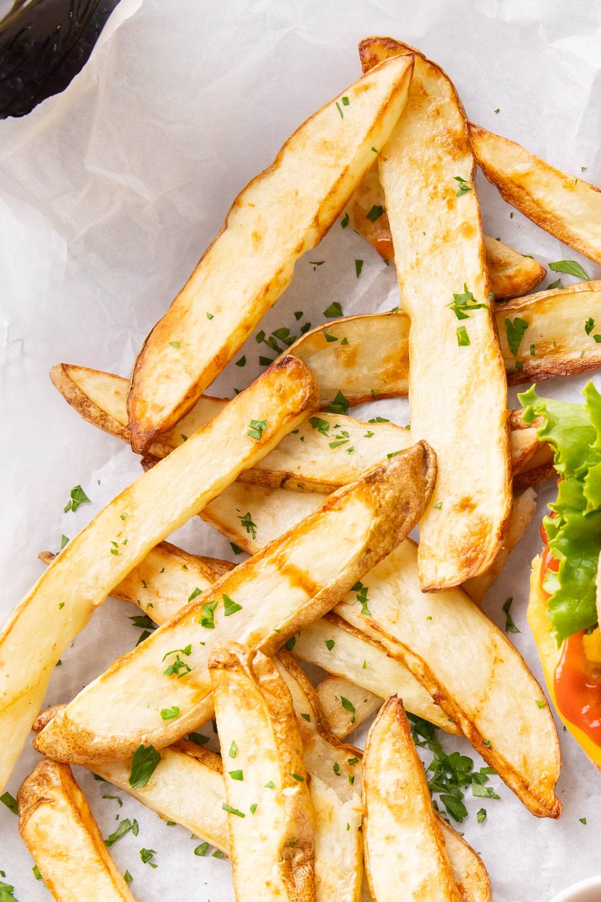 Close up of the browned, crunchy edges of this air fryer French fries recipe
