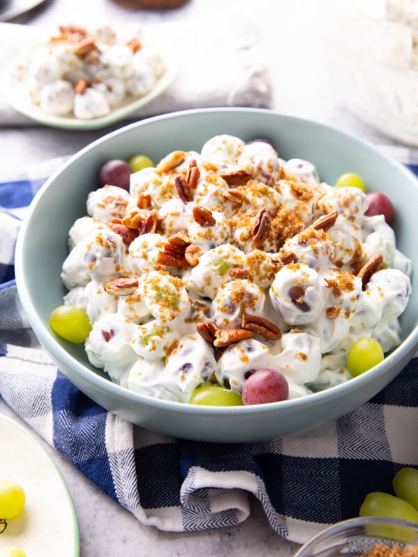 Grape Salad served in a bowl with red and green grapes and sweet cream cheese dressing.