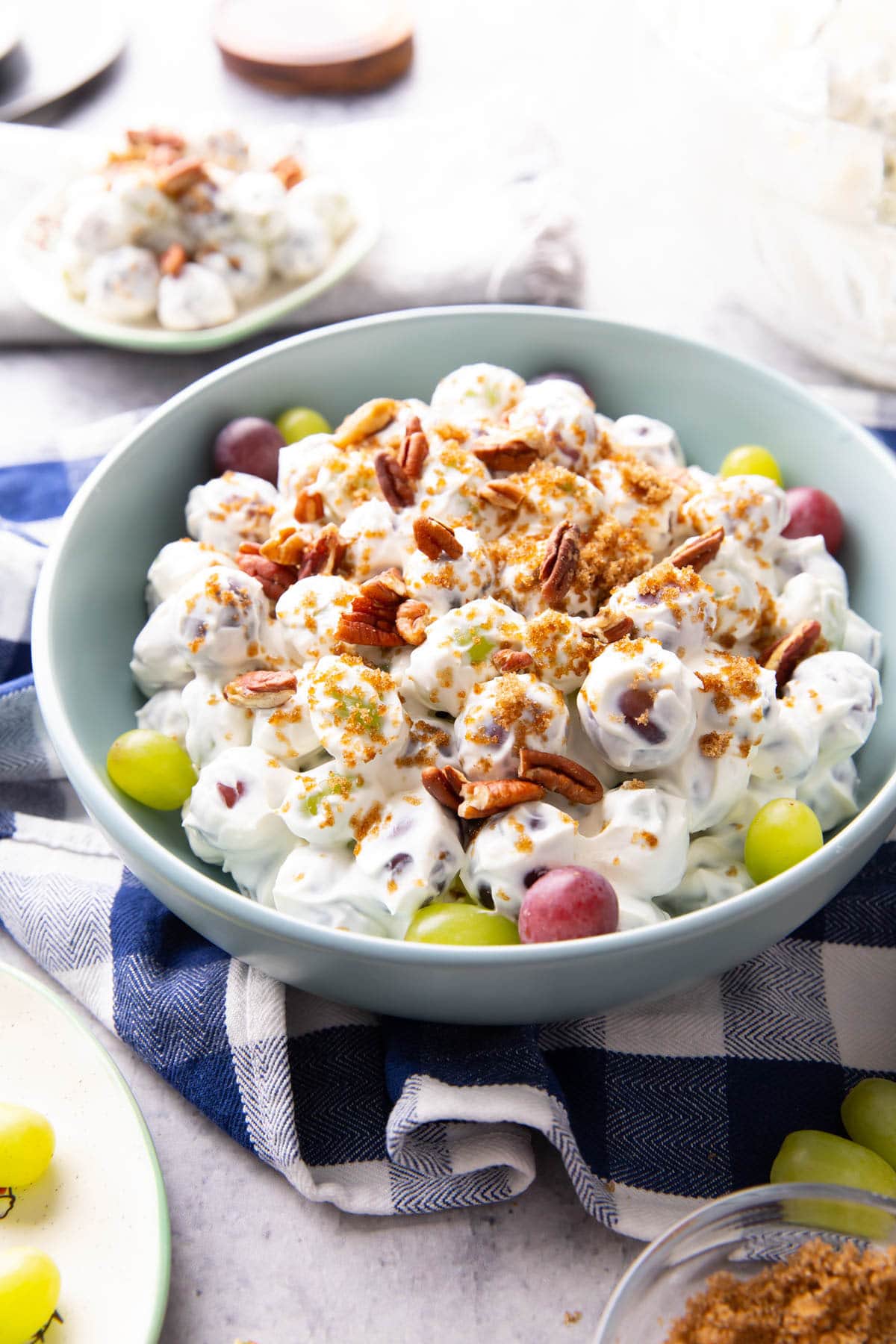 Grape Salad served in a bowl with red and green grapes and sweet cream cheese dressing