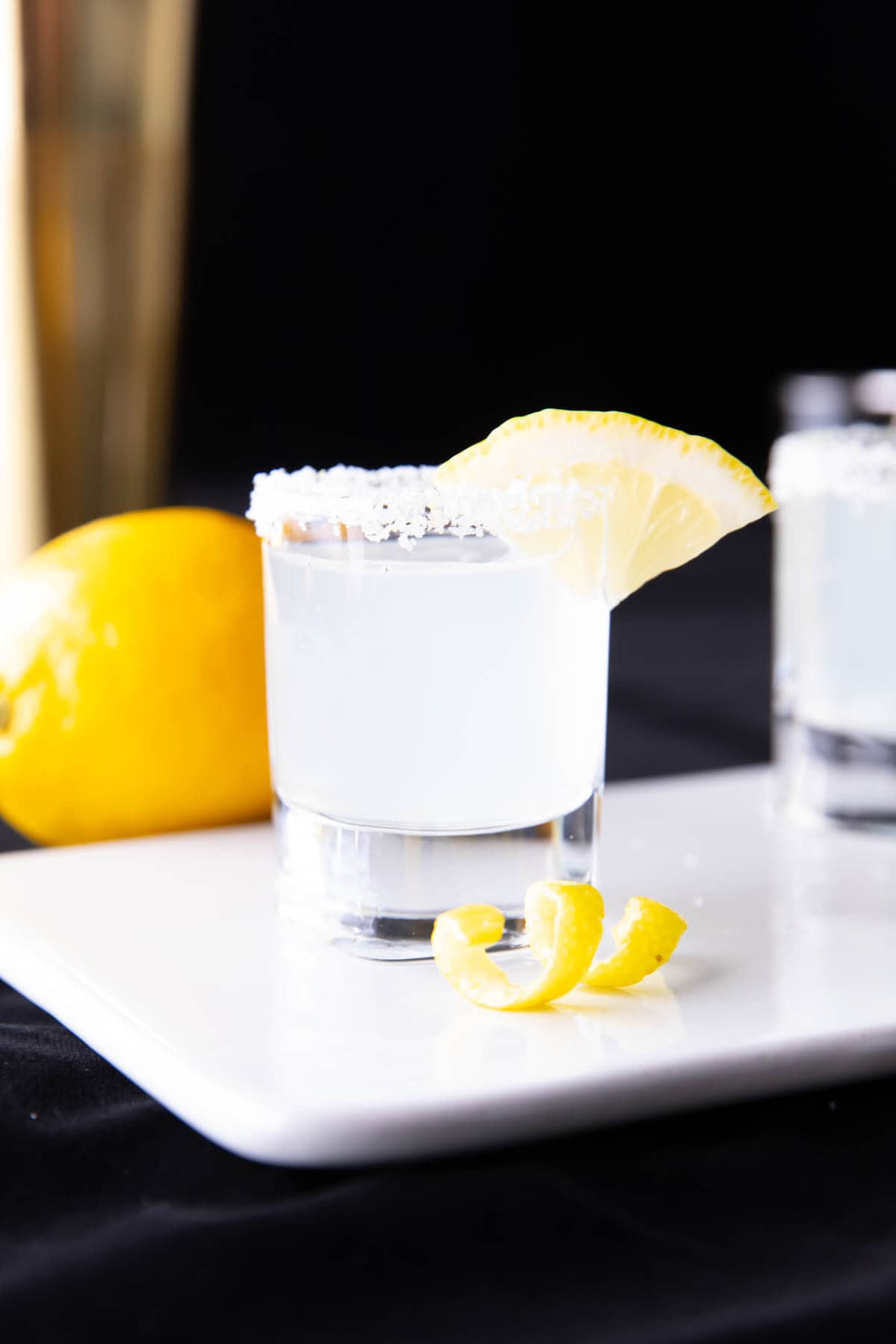 A Lemon Drop Shot served with a sugared rim and a lemon wedge