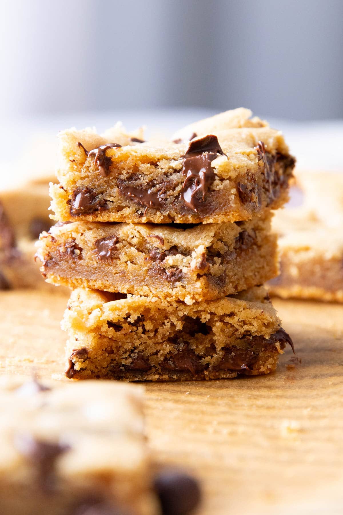 Stack of Blondie Peanut Butter bars with crispy edges and soft centers