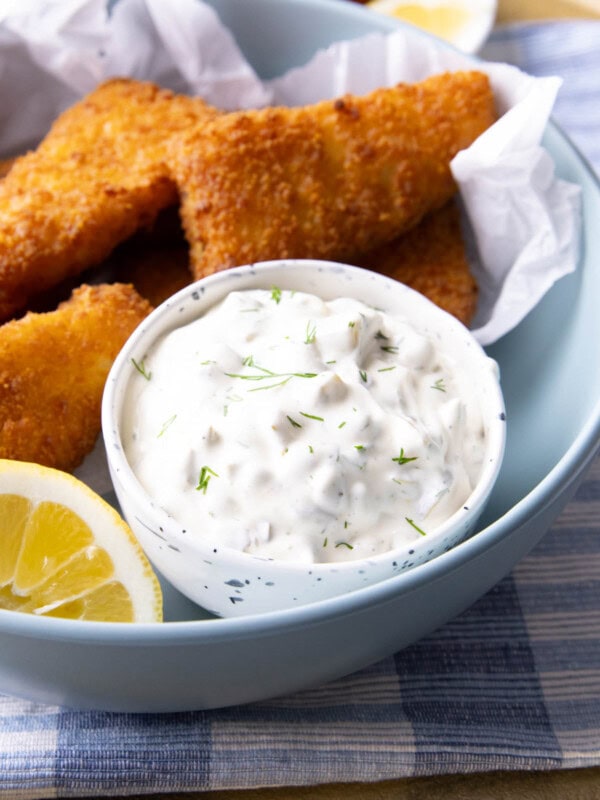 Tartar Sauce recipe served in a bowl with a lemon wedge.