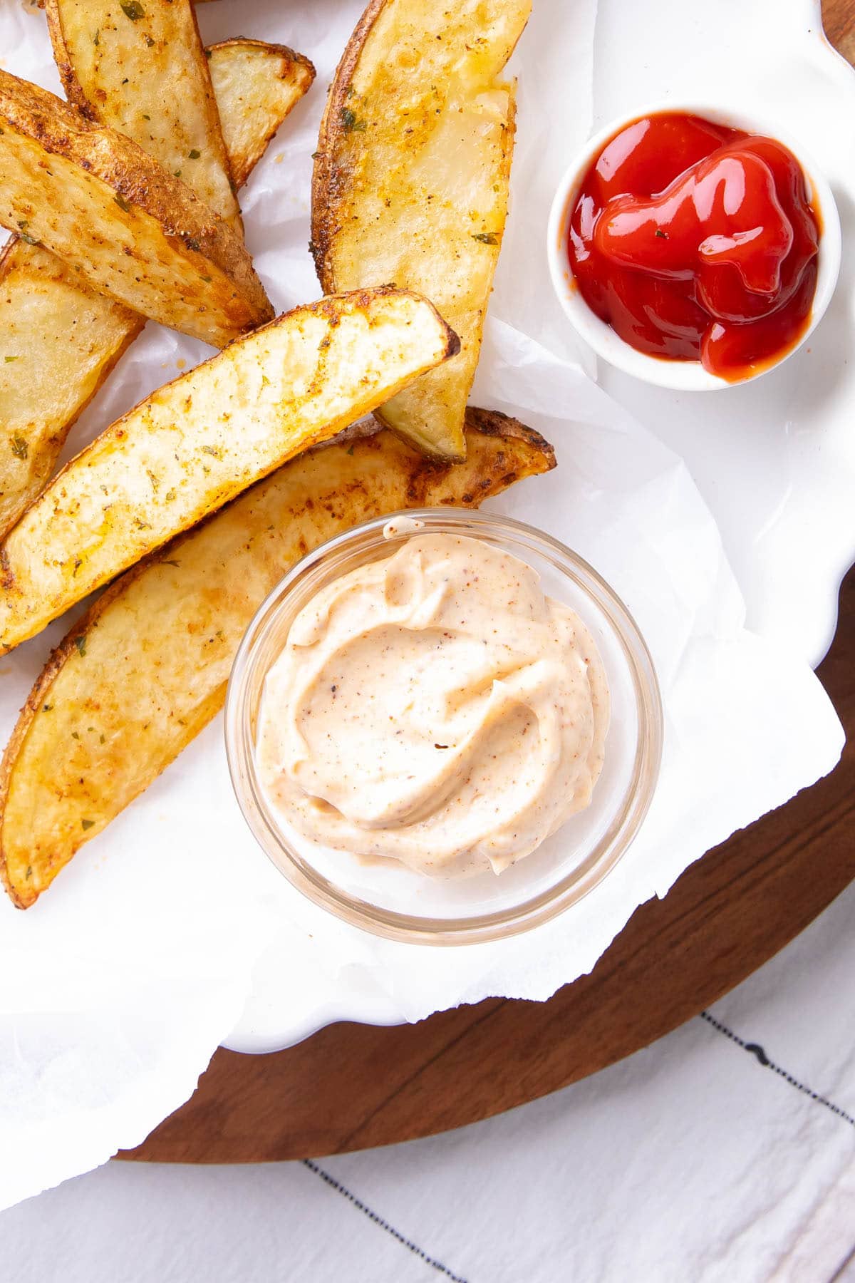 Top view of a dip bowl filled with this spicy and creamy pepper sauce served with a fried appetizer and ketchup