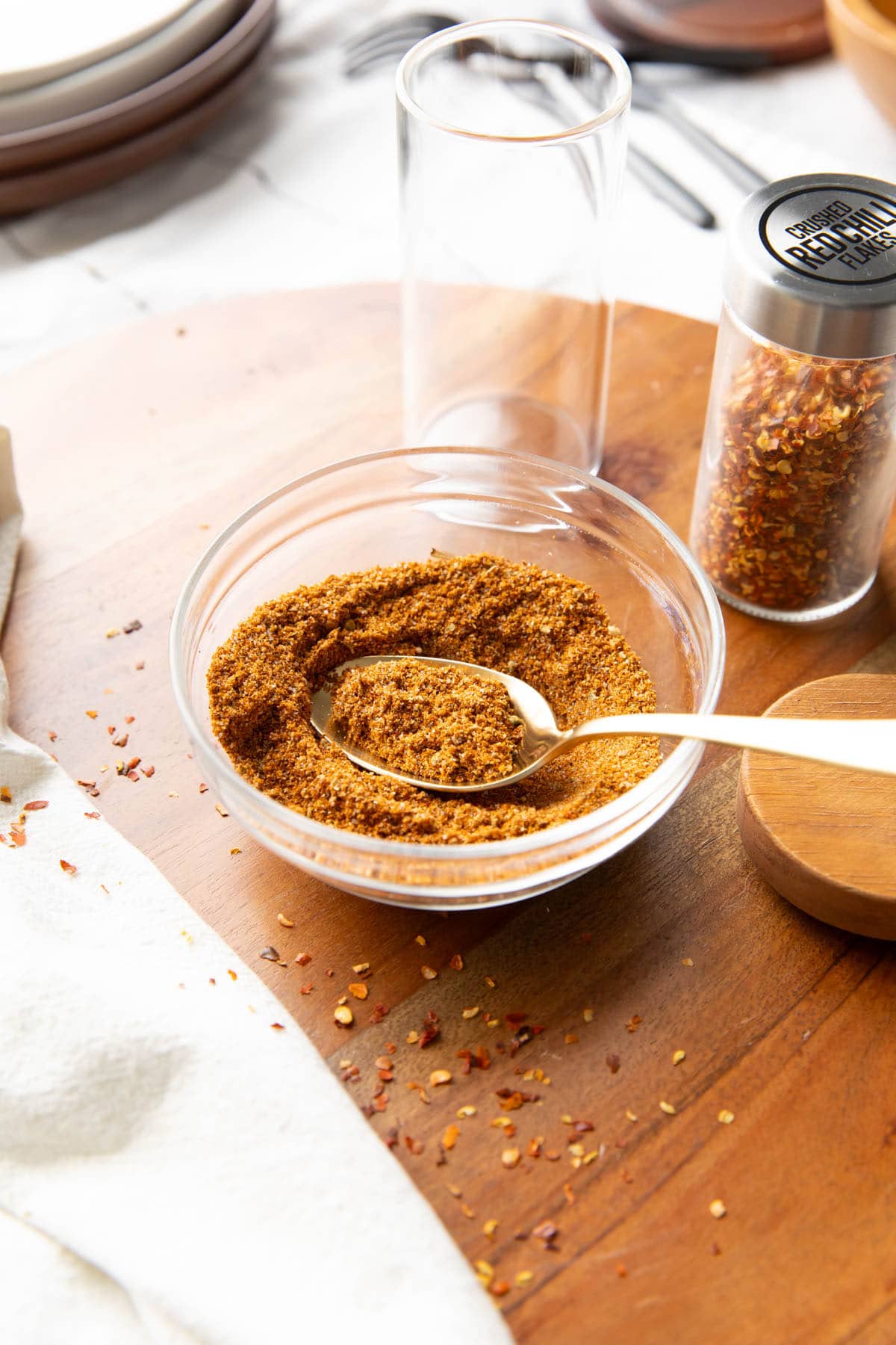 taco seasoning recipe in a small bowl with a spoon in it