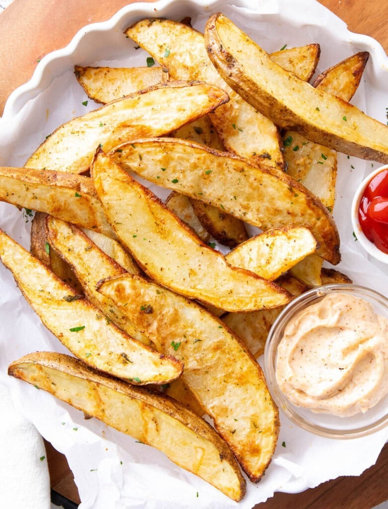 Appetizers photo featuring air fryer potato wedges, ketchup, and dipping sauce