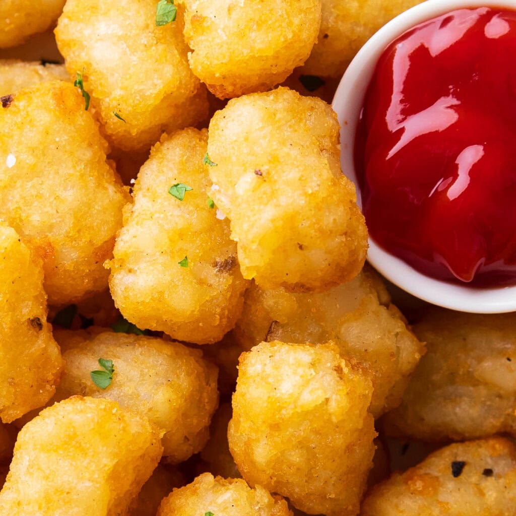 close up of air fryer tater tots to show crisp edges