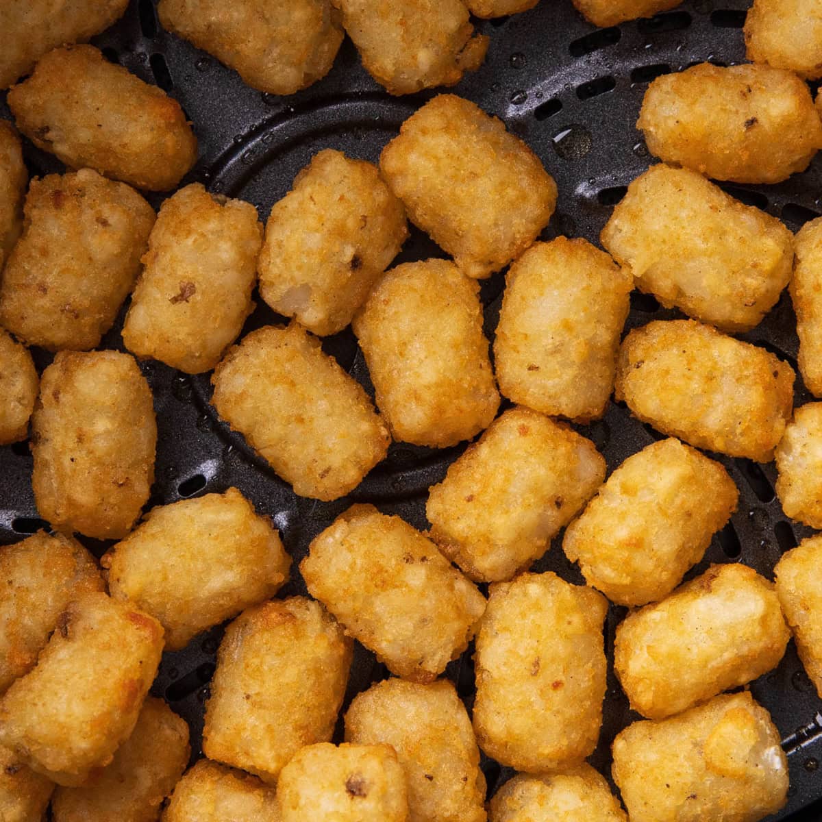 Frozen tater tots in air fryer cooked and golden